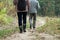 Senior people walking with sticks on trekking in the mountain