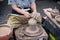 Senior potter& x27;s hands shaping decorative clay hollow sculpture t