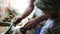 Senior potter teaching happy little boy the art of pottery