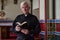 Senior priest with BIble in church