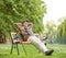 Senior relaxing on a wooden bench