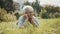 Senior retired woman enjoying the sunny autumn day in the park