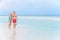 Senior Romantic Couple Walking In Beautiful Tropical Sea