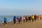 Senior runners on sandy beach