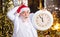 Senior santa man in tuxedo. Garland illumination background. Bearded businessman in santa hat. Christmas eve. Santa