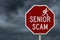 Senior Scam message on red street stop sign