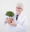 Senior scientist holding plant