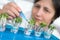 Senior scientist or tech picks cress sprouts for testing