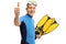 Senior with snorkeling equipment making a thumb up gesture