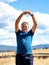 Senior spanish man retired sportsman wearing doing side stretching exercises