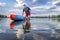 Senior stand up paddler on a lake