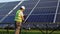 Senior technician working outdoor on ecological solar farm construction