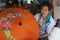 Senior Thai woman produces traditional bamboo umbrella at the factory in Chiang Mai, Thailand.