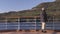 Senior tourist on cruise ship in Alaska enjoying view of inside passage nature