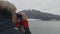 Senior tourist looking at Alaska Glacier Bay using binoculars on cruise ship