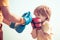 Senior trainer and little boy wearing boxing gloves. Portrait of a determined senior boxer with little boy child over