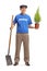 Senior volunteer holding a plant and a shovel