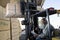 Senior Warehouse Worker Stacking Wood By Forklift