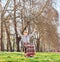 Senior in wheelchair gesturing happiness in park