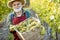 Senior winemaker with grapes on the vineyard