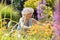 Senior woman with an active lifestyle enjoying retirement with garden work