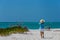 Senior woman admiring the ocean and beach.