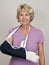 Senior woman with arm in cast and sling