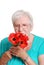 Senior woman with artificial red poppies