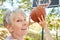 Senior woman as a sporty pensioner playing basketball