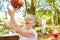Senior woman as a vital pensioner playing basketball