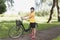 Senior woman bicycling in a park at sunny afternoon