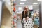 Senior woman buying toliet paper in supermarket.