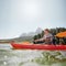 Senior woman canoeing on a summer day