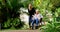 Senior woman, care and wheelchair in park with daughter, family or caregiver outdoor for air, health and wellness