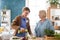 Senior woman with caregiver or healthcare worker indoors, drinking healthy smoothie.