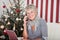 Senior woman chatting on the phone at Christmas