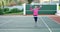 Senior woman cheering in tennis court 4k