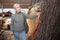 Senior woman choosing decorative branches in store