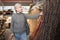 Senior woman choosing decorative branches in store