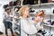 Senior woman choosing running shoes in shoe store