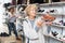 Senior woman choosing running shoes in shoe store