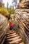 Senior woman climbing the steep stairway that goes from the top of the Athabasca Falls to the canyo