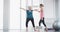 Senior, woman and coach with stretching for fitness, exercise or workout in gymnasium with instructions. Elderly, person