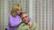 Senior woman comforting her husband