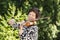 Senior woman concentrating while playing music outdoors