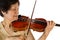 Senior woman concentrating while playing the violin