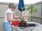 Senior Woman Creating A Wisteria Bonsai Tree