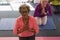 Senior woman doing yoga in fitness studio