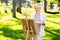 Senior woman with easel painting outdoors