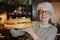 Senior woman eating an extra large sandwich